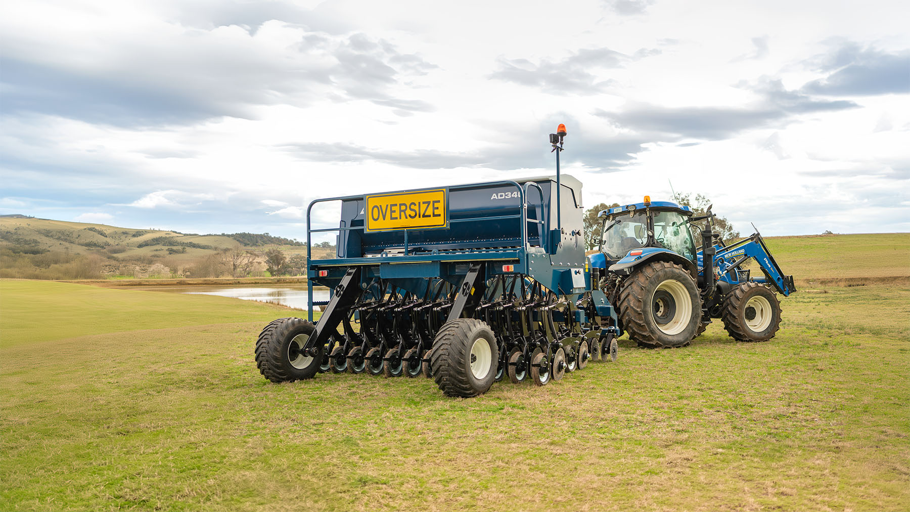 AD340 disc seeder in field with NH tractor