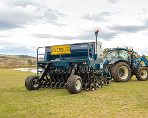 AD340 in field with NH tractor mobile